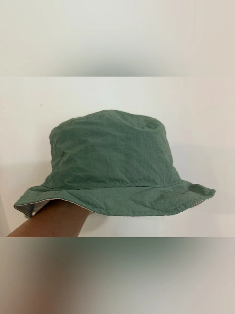 Toddler Classic Lightweight reversible Bucket Hat in cream & light olive green.